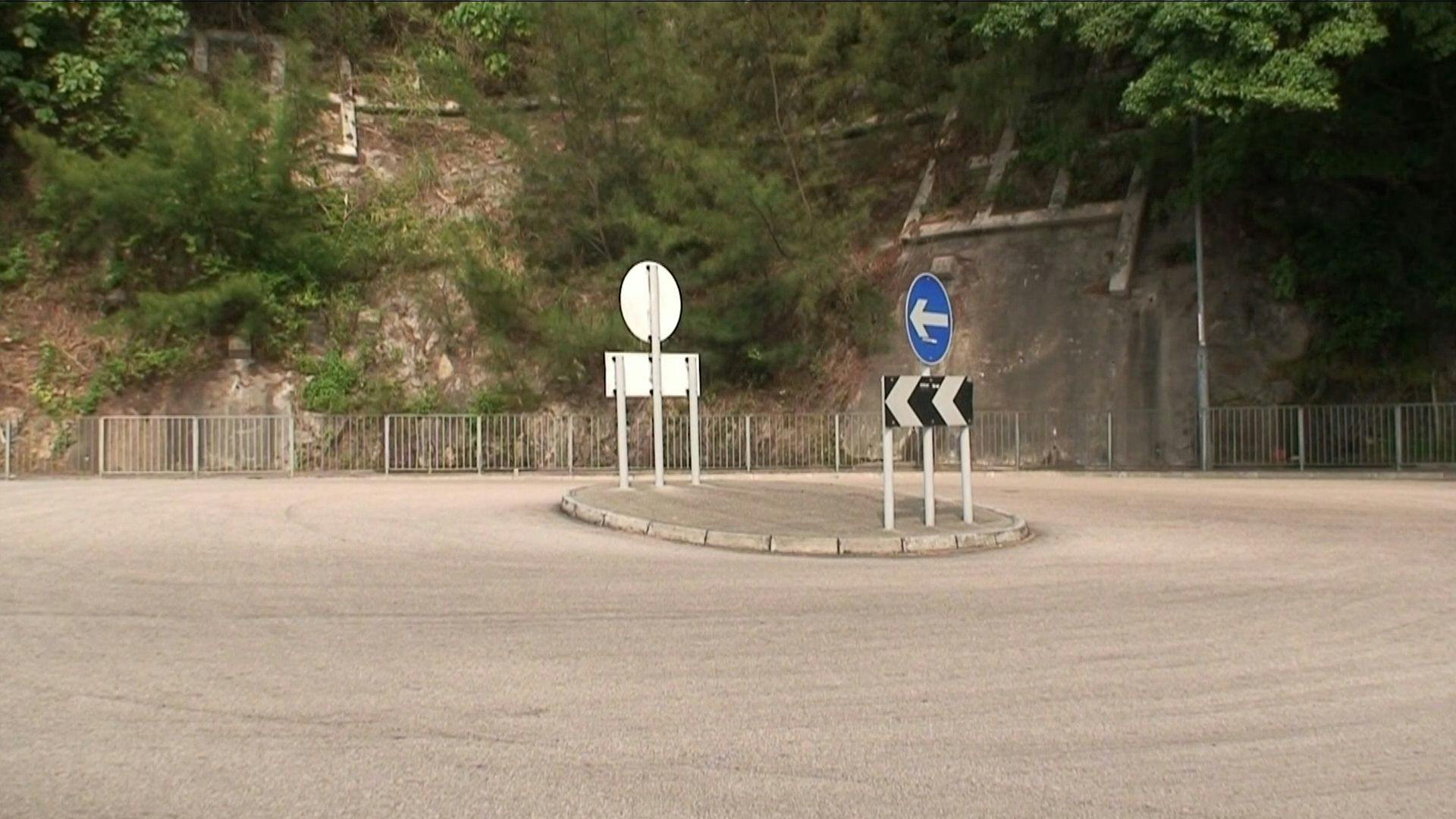 an image of a roundabout in a road.