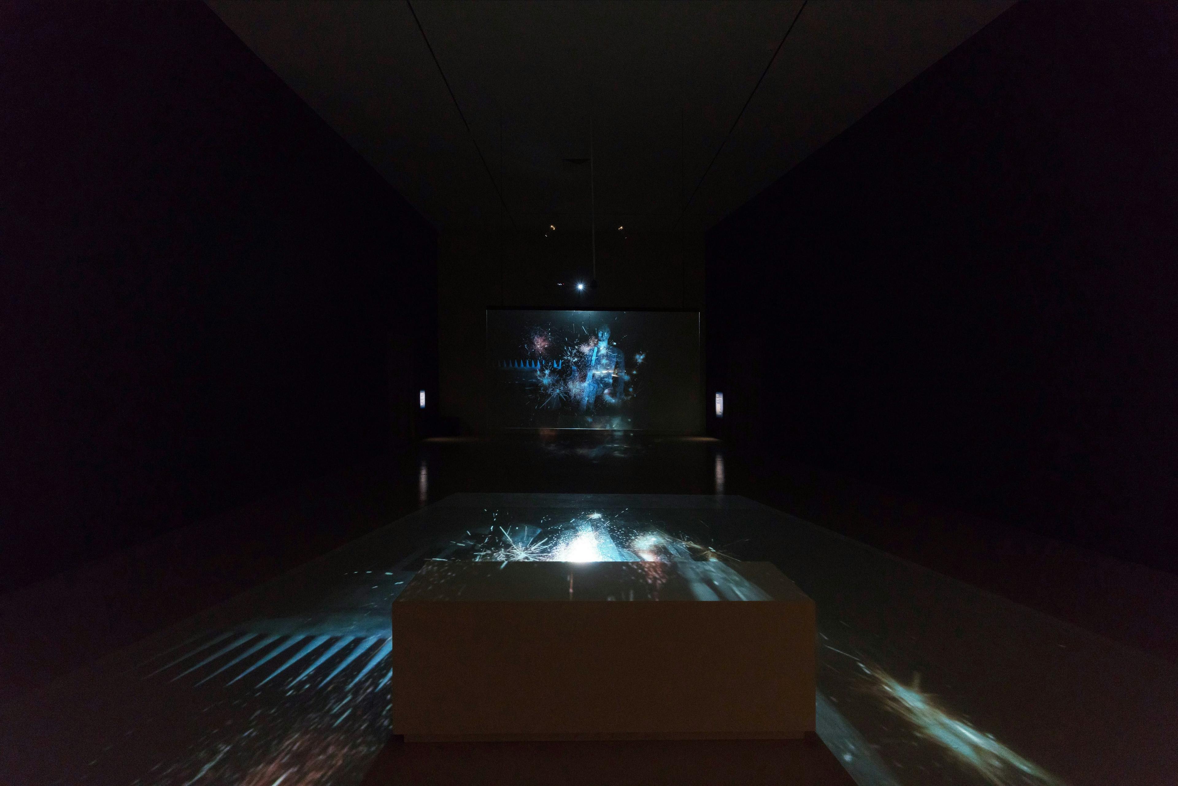 an installation image of Fireworks (Archives) projected in a darkened space