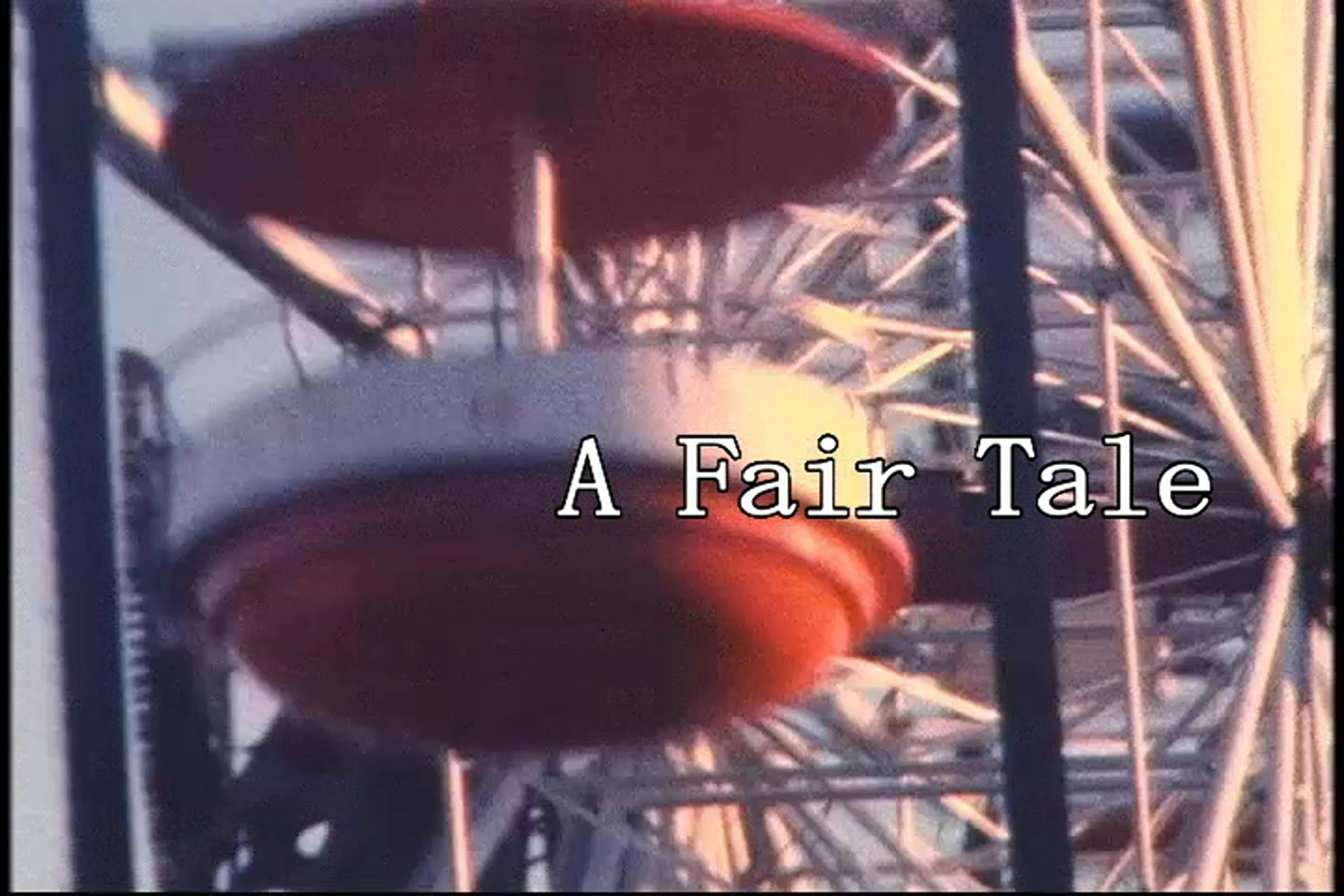 Image of a red and white fair ground ferris wheel with the words 'A Fair Tale' captioned on top