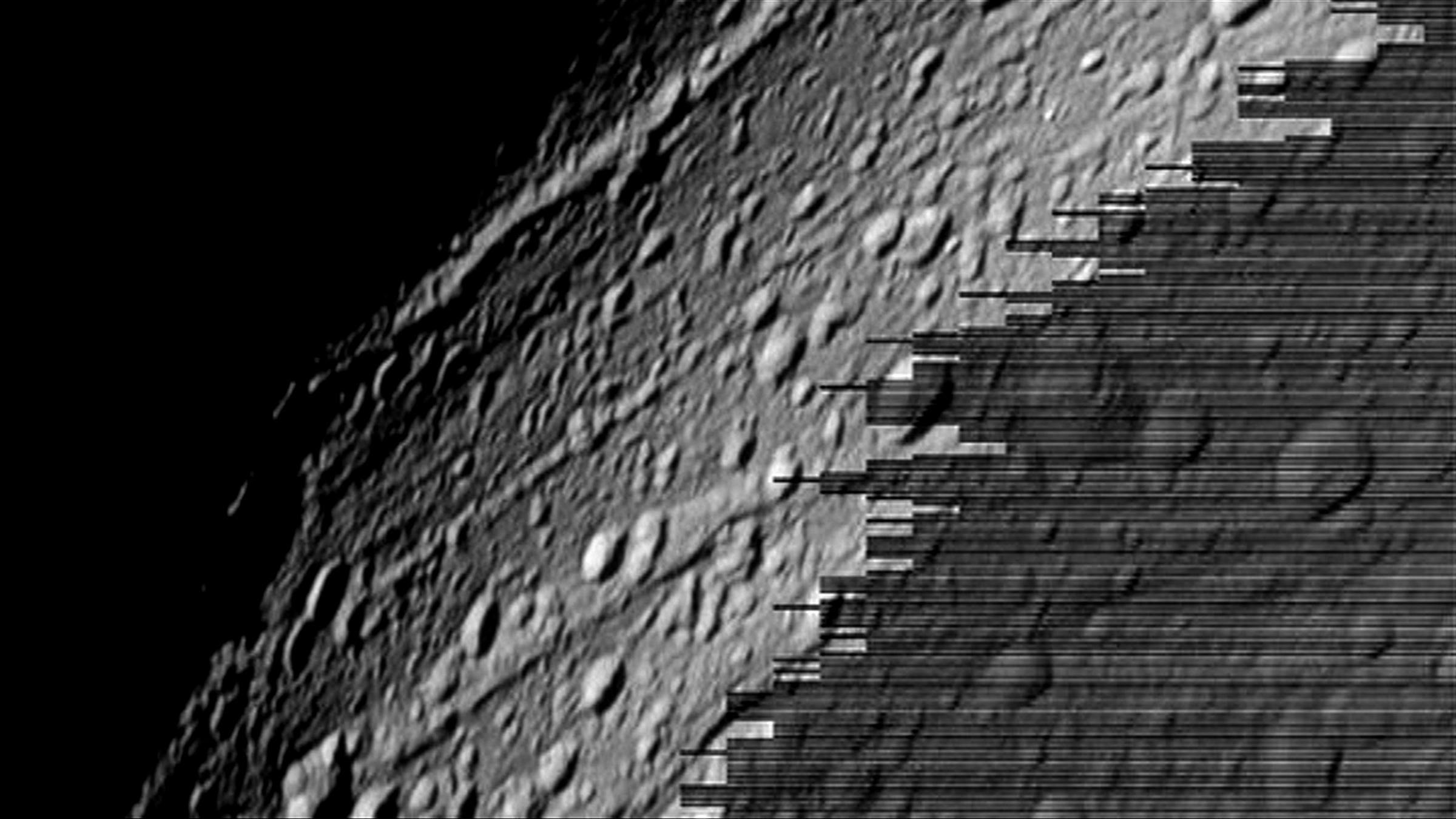 a digitally rendered image of a the surface of the moon in space. The right hand side of the image is glitchy