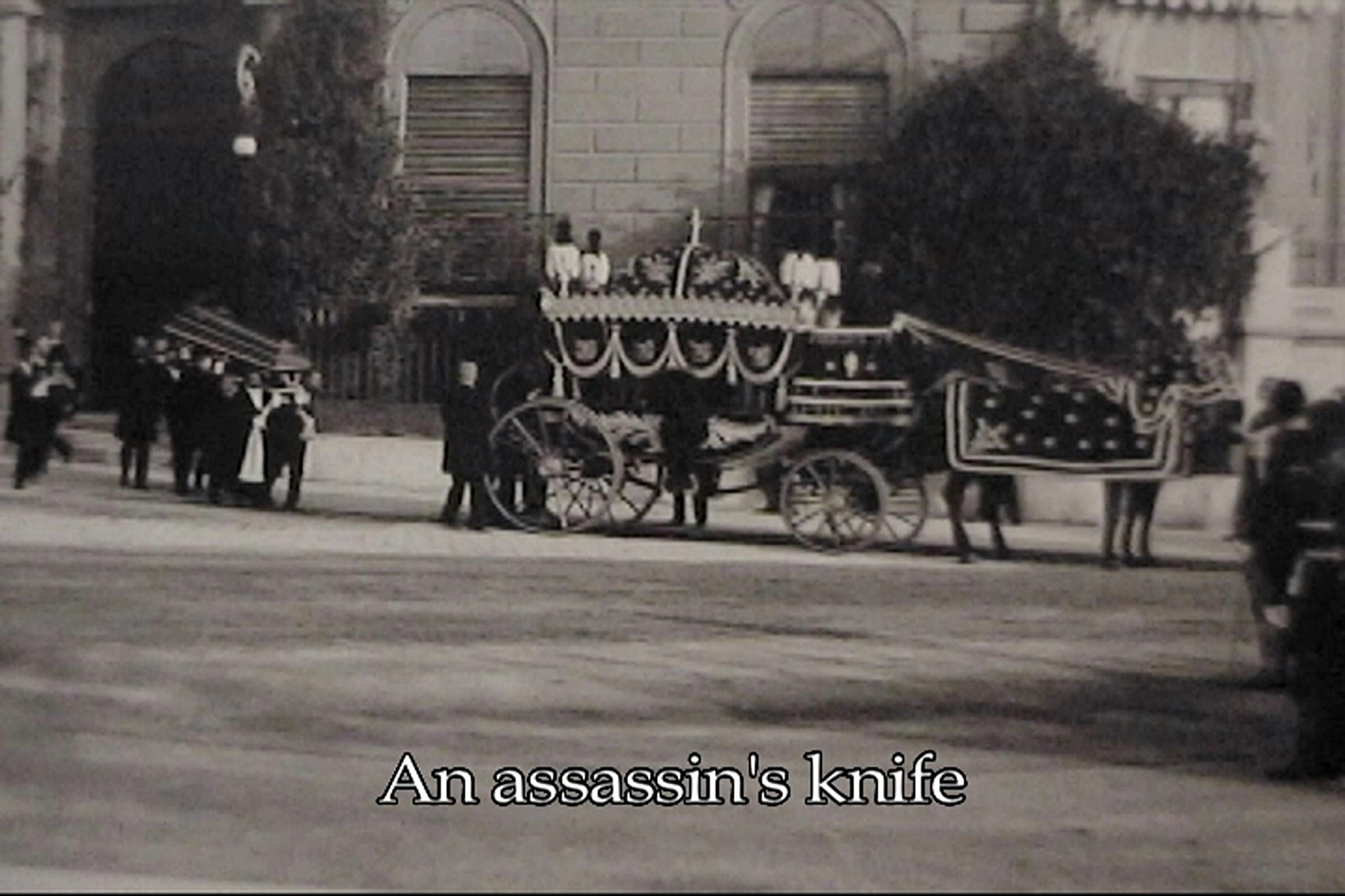 Black and white image of a funeral procession with a coffin being carried to a horse and carriage. The words 'An assassin's knife' are superimposed on top.